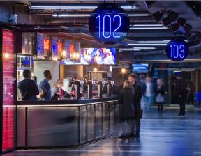 Guests and staff at modern bar venue